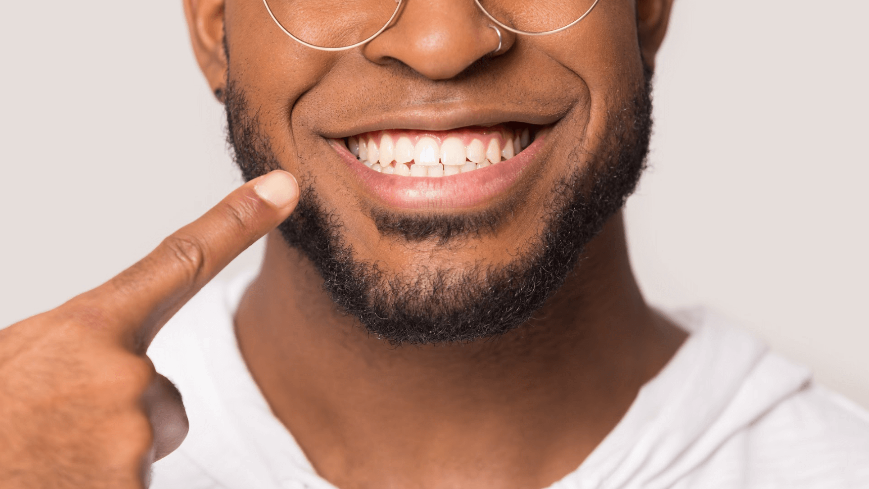 man with glasses smiling